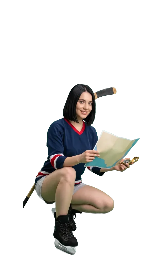 Woman crouching with a paper map and a compass