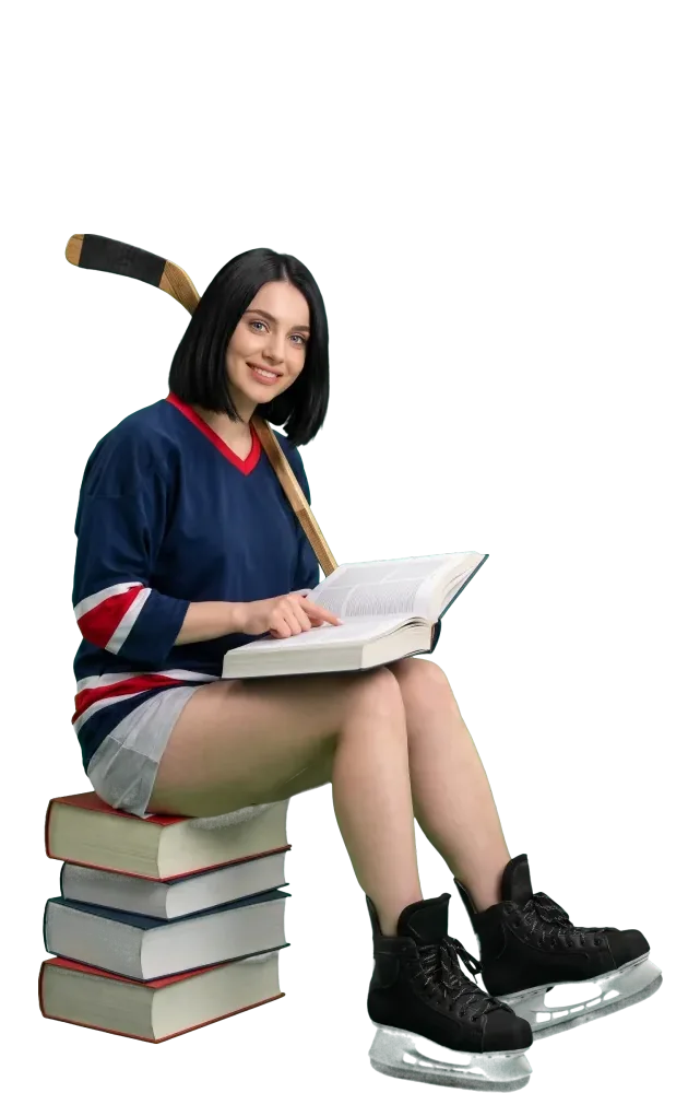 Woman sitting on a stack of books and reading a book