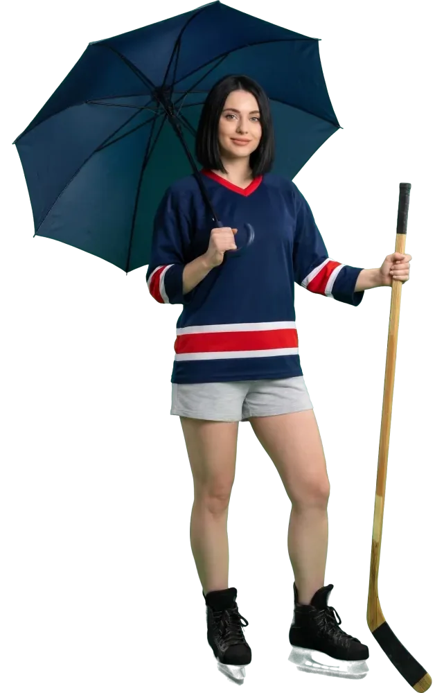 Woman holding an open umbrella and a hockey stick