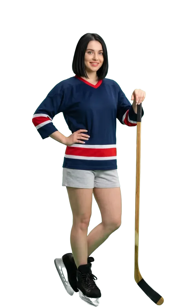Woman in a hockey jersey and skates leaning on her stick