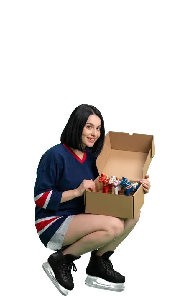 Woman peeking into a box with three small horse figurines