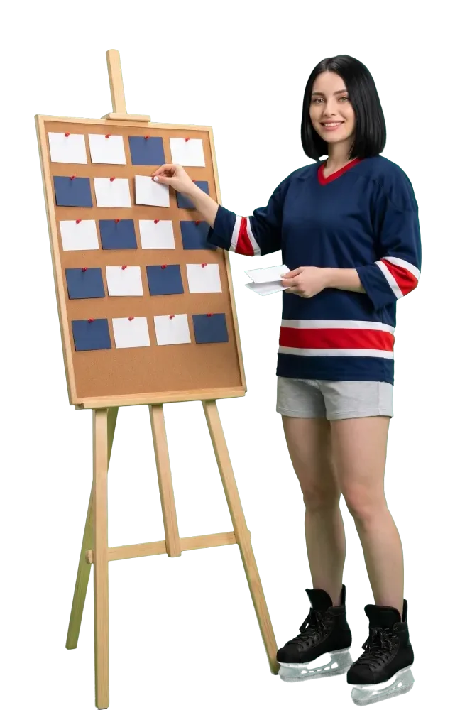 Woman pinning blank cards in rows on a cork board