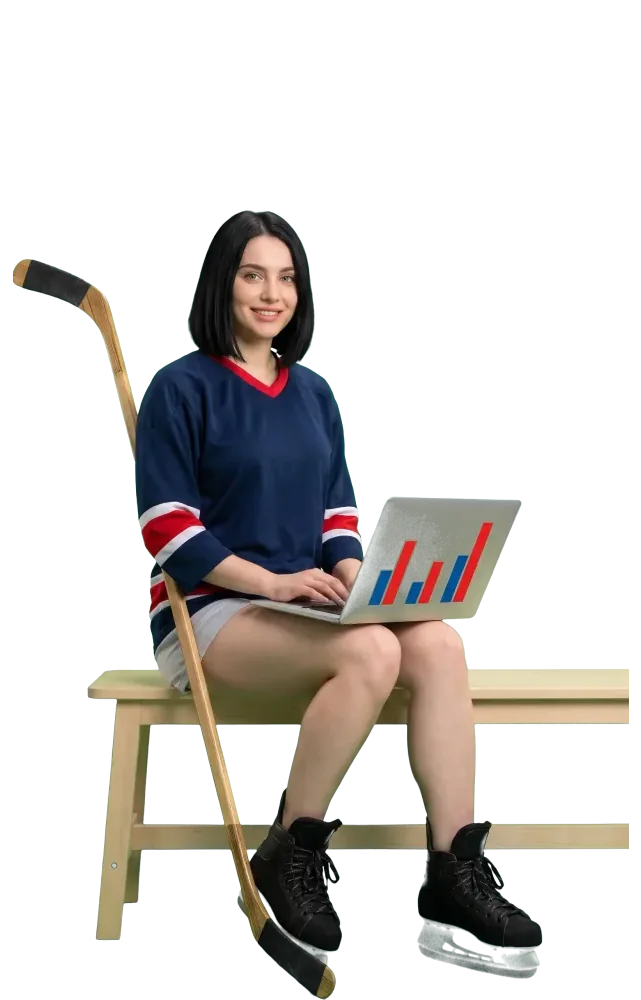 Woman on a bench working on a laptop