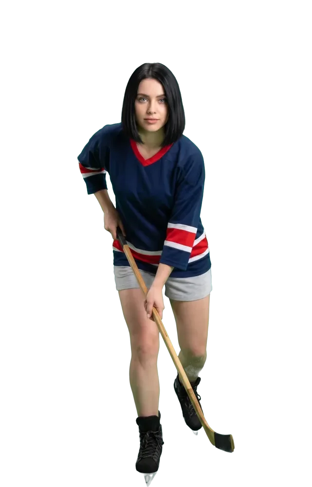 Woman skating forward with her hockey stick