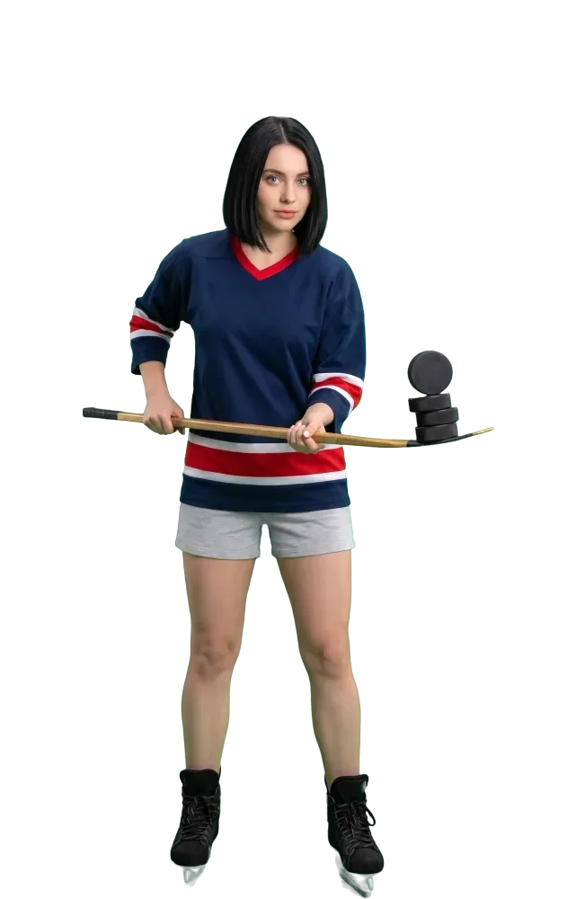 Woman balancing three stacked pucks on the blade of her stick