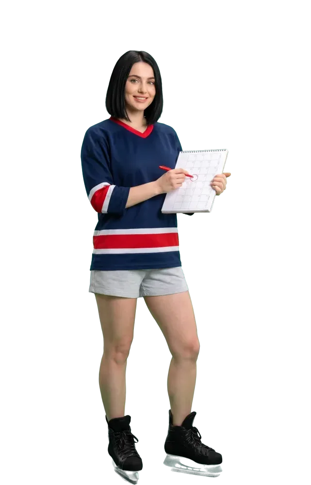Woman marking a square in an open planner